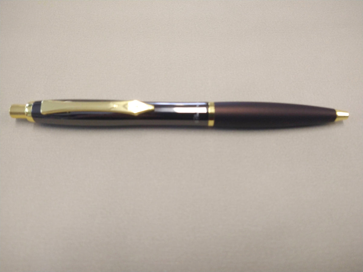 Gunmetal Platignum No. 9 ballpoint pen with gold-tone accents and metal clip.