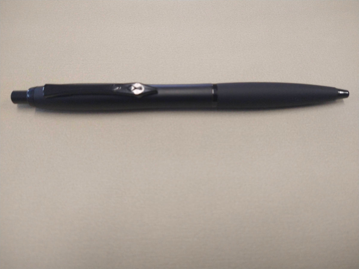 Matte black Platignum No. 9 ballpoint pen with soft grip and metal clip.