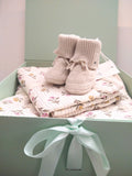 Petite Evelina Meadow Whisper baby blanket and swaddle with Saga Copenhagen Daisy booties ready to gift in Solefina gift box.
