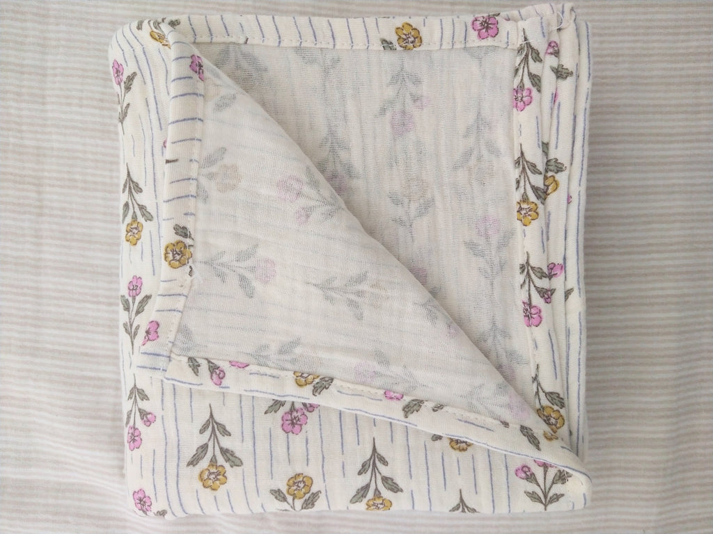 Petite Evelina Meadow Whisper muslin baby swaddle showing layered construction