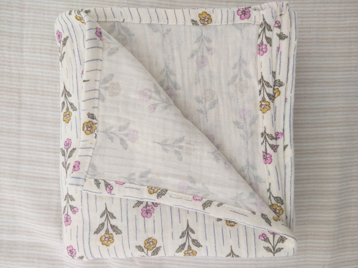 Petite Evelina Meadow Whisper muslin baby swaddle showing layered construction