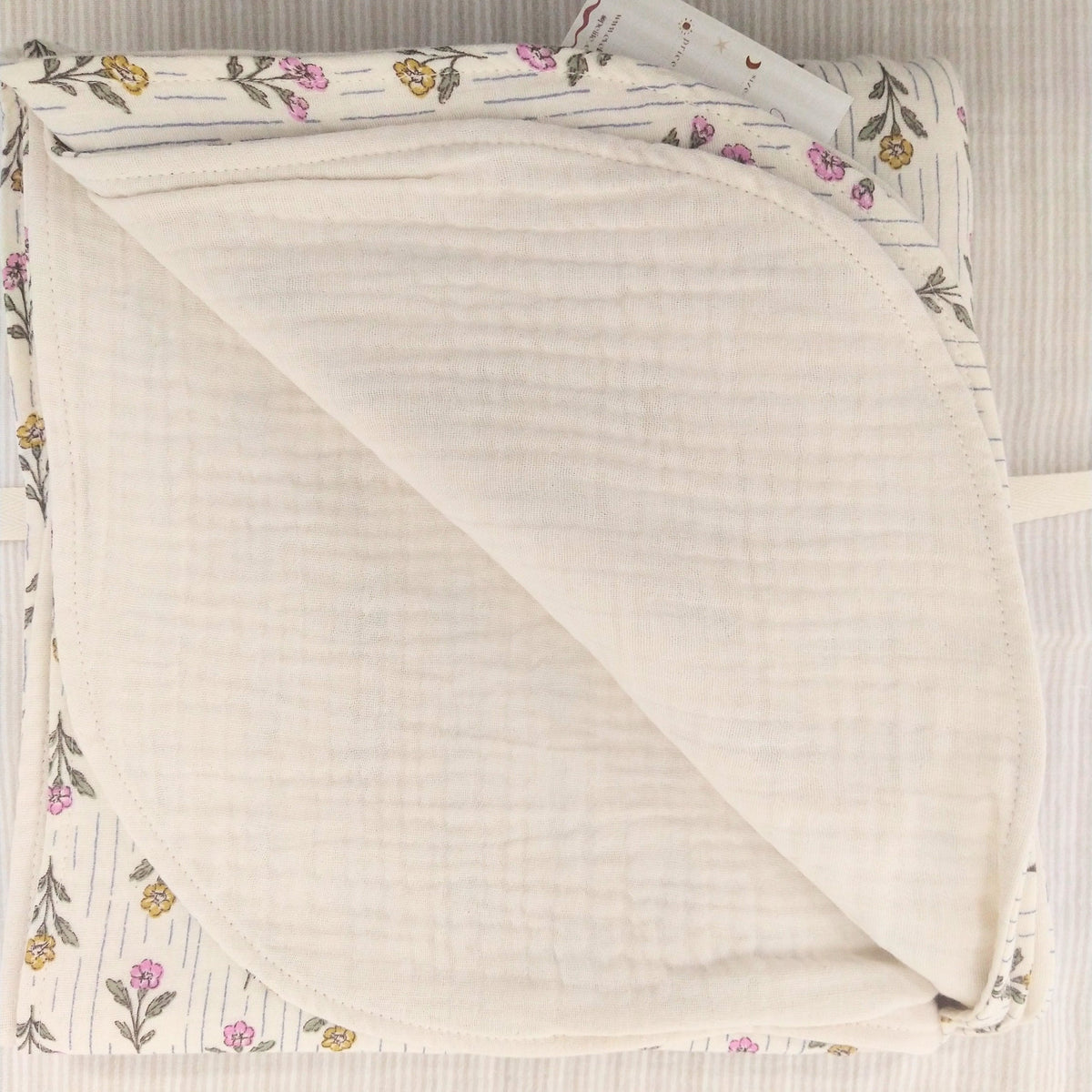 Petite Evelina Meadow Whisper muslin baby blanket showing layered construction