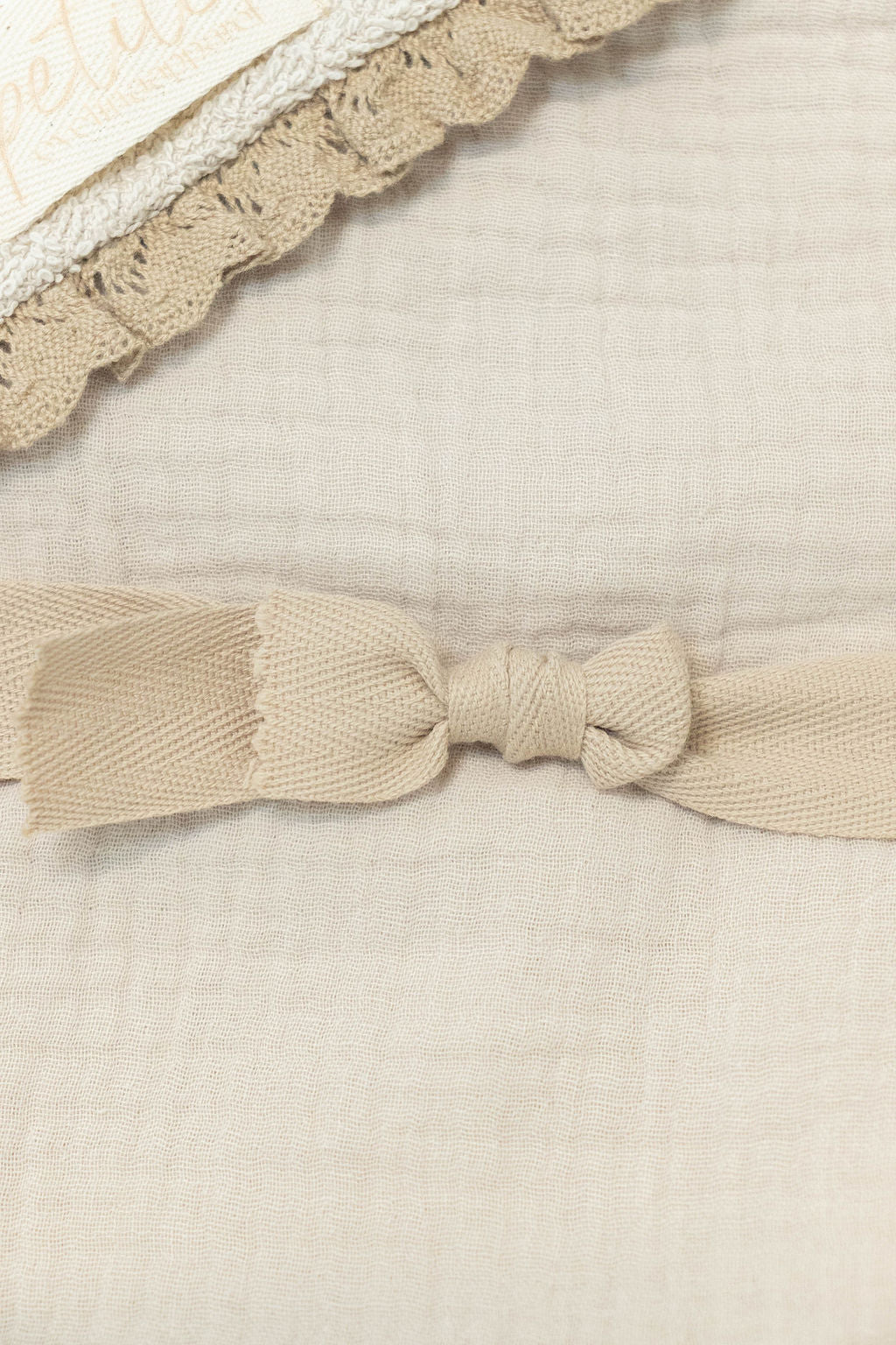 Petite Evelina Light Beige lace hooded baby towel close-up showing muslin texture and lace trim