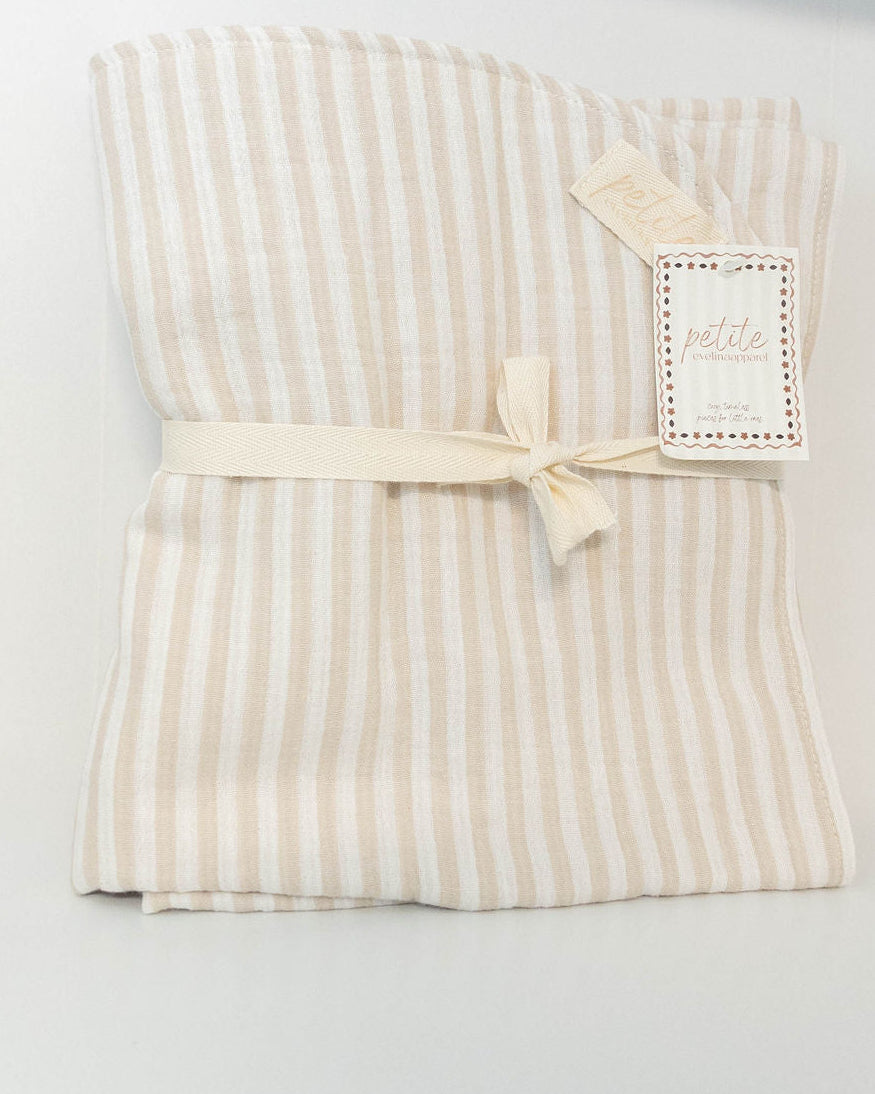 Petite Evelina beige striped muslin baby blanket folded and tied with cream ribbon, with brand tags visible