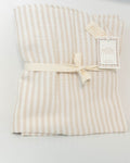 Petite Evelina beige striped muslin baby blanket folded and tied with cream ribbon, with brand tags visible