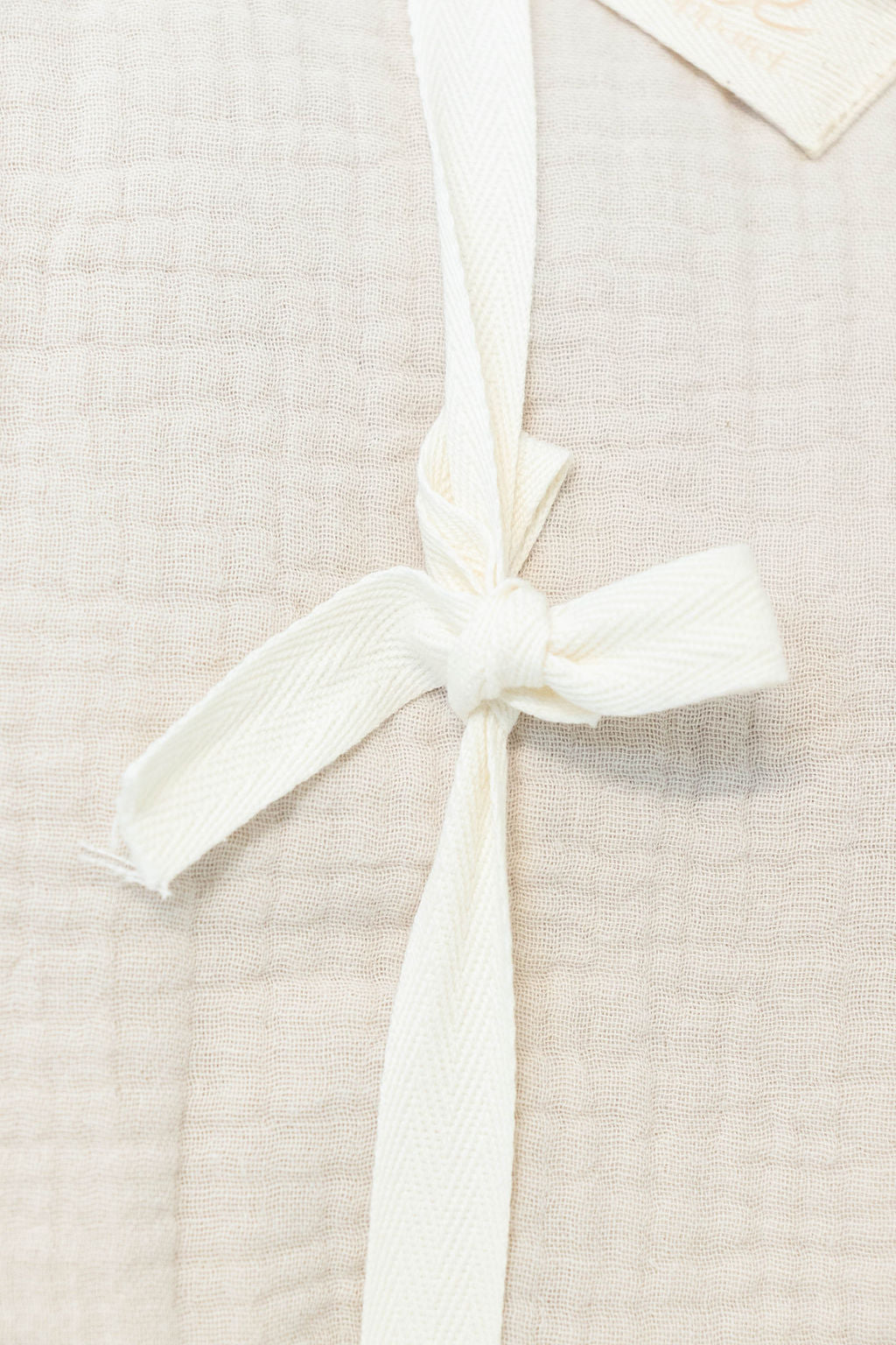 Petite Evelina light beige muslin baby blanket showing textured layers