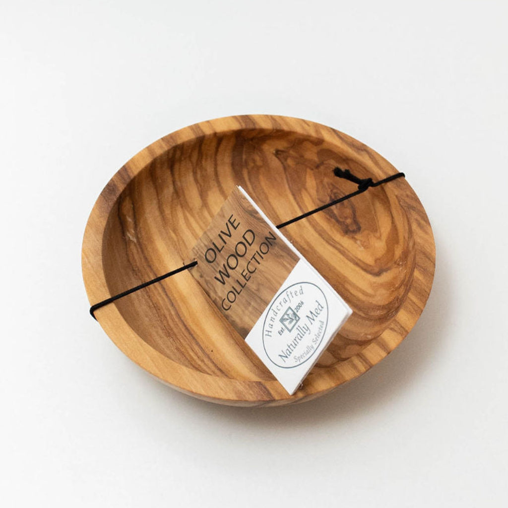 Handcrafted round olive wood dipping dish with natural wood grain