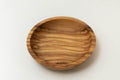 Handcrafted round olive wood dipping dish with natural wood grain