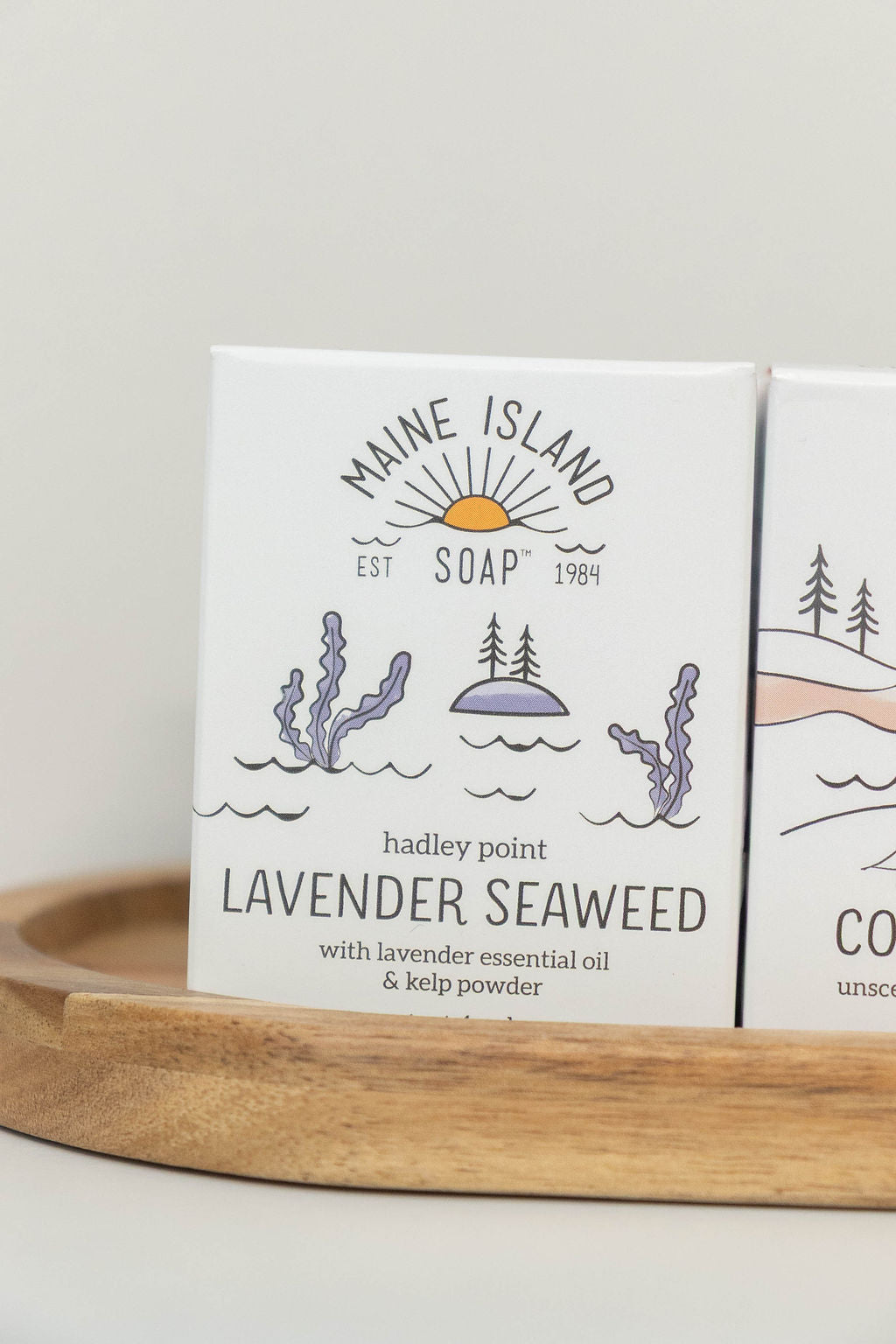Maine Island Soap Lavender Seaweed bar displayed with other scents on a wooden tray