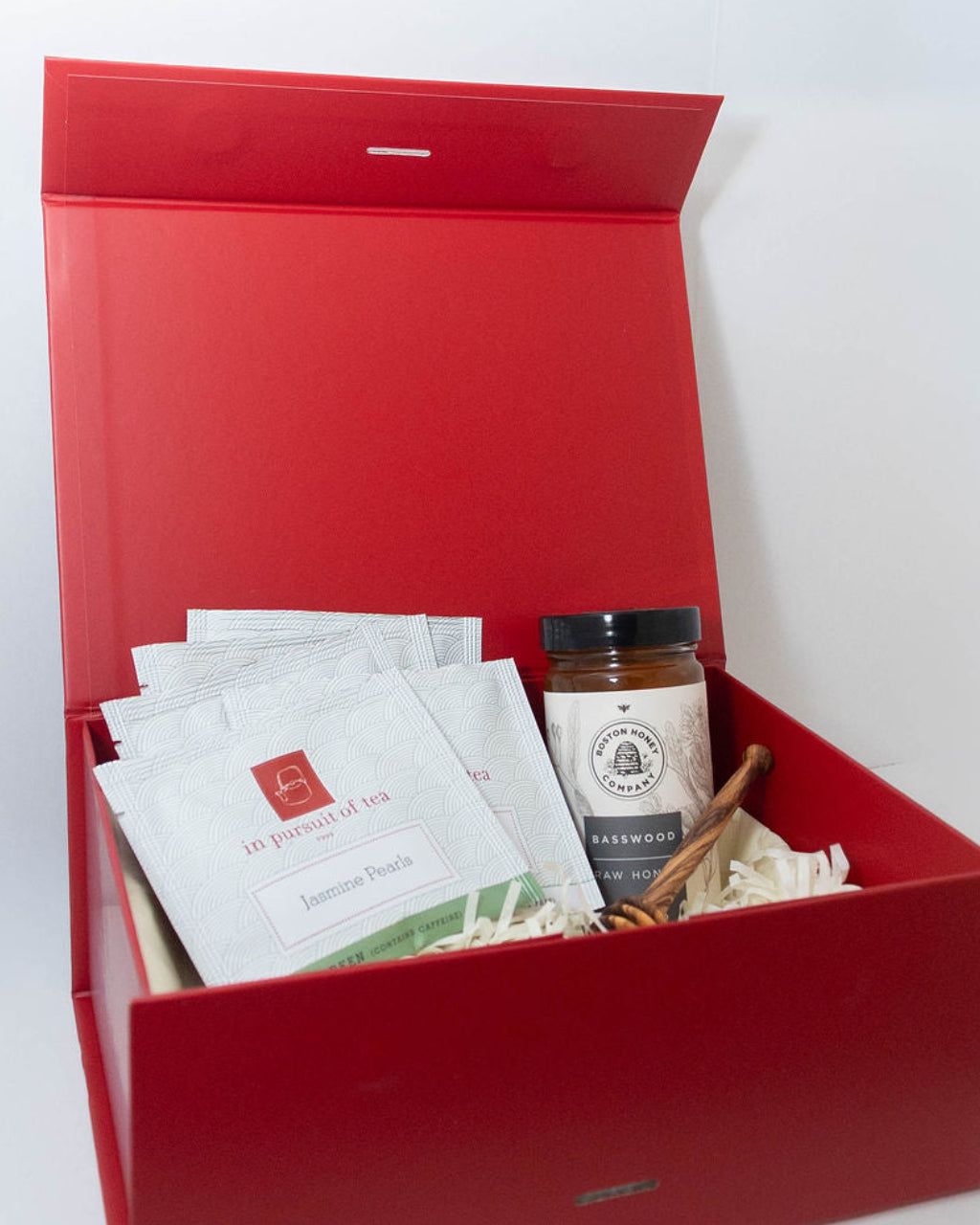 Tea and Basswood honey gift box with assorted In Pursuit of Tea sachets and wooden honey dipper