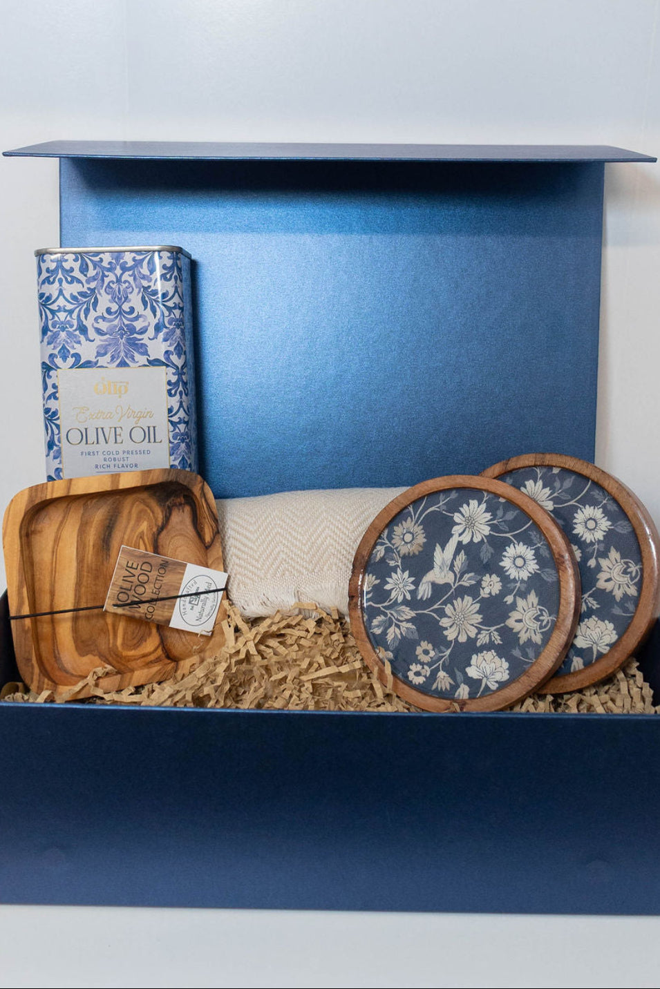 Mediterranean gift box with olive oil, olive wood dipping dish, floral coasters and peshtemal towel.