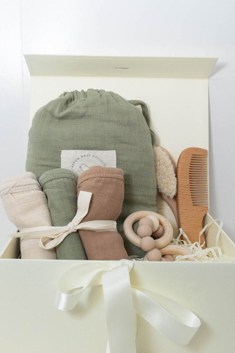 Plum & Sparrow olive baby hooded towel, washcloths, teether and wooden brush and comb set.