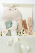 Baby bath gift set with Plum & Sparrow hooded towel washcloths and teether, wooden brush and comb.