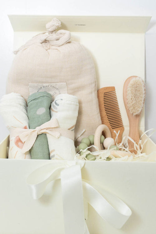 Baby bath gift set with Plum & Sparrow hooded towel washcloths and teether, wooden brush and comb.