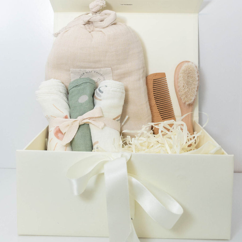 Baby bath gift set with Plum & Sparrow hooded towel washcloths and teether, wooden brush and comb.