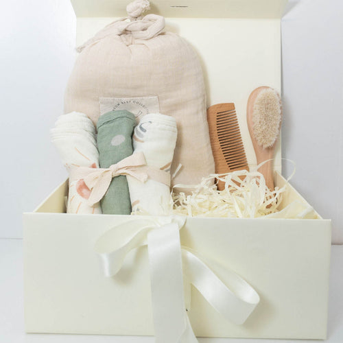 Baby bath gift set with Plum & Sparrow hooded towel washcloths and teether, wooden brush and comb.