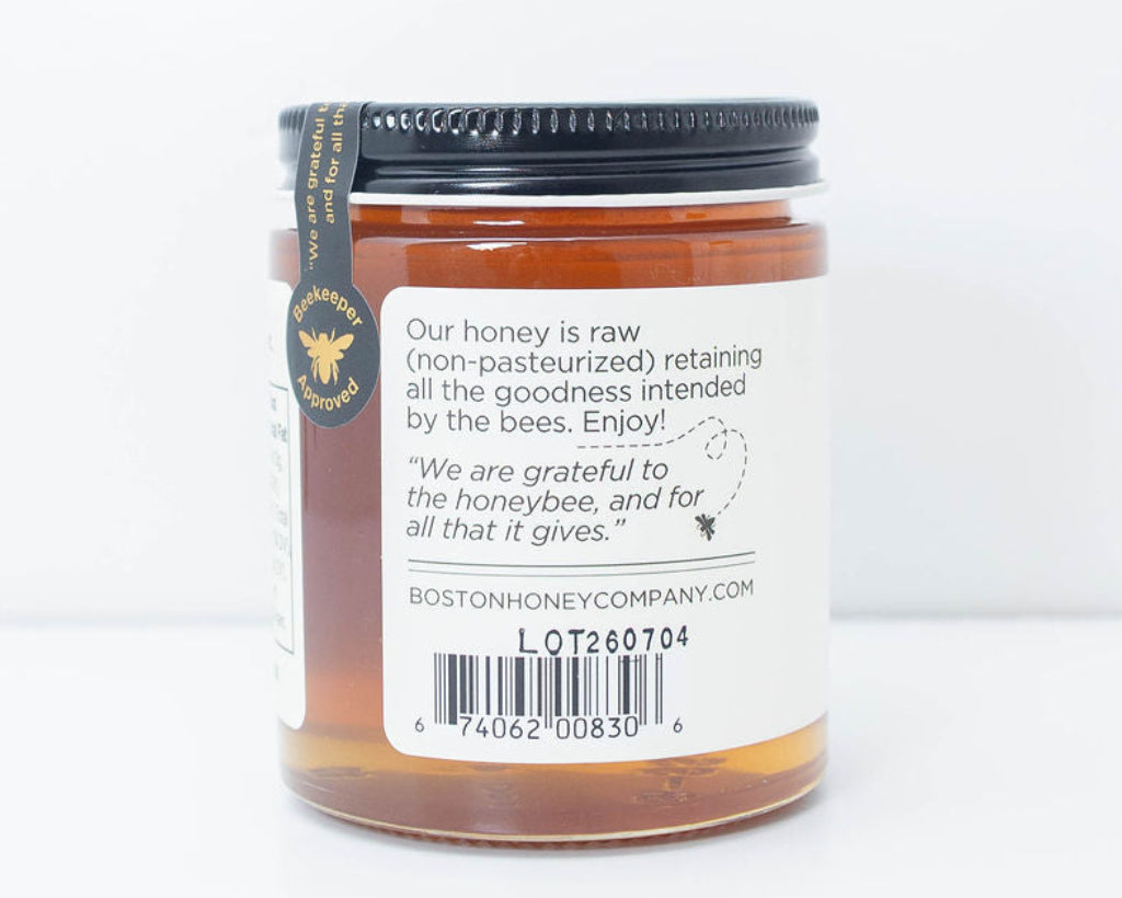 Back of Boston Honey Company Wildflower Raw Honey jar showing raw honey description