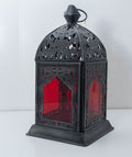 Decorative metal lantern with ruby red glass panels, individually selected in Rabat, Morocco.