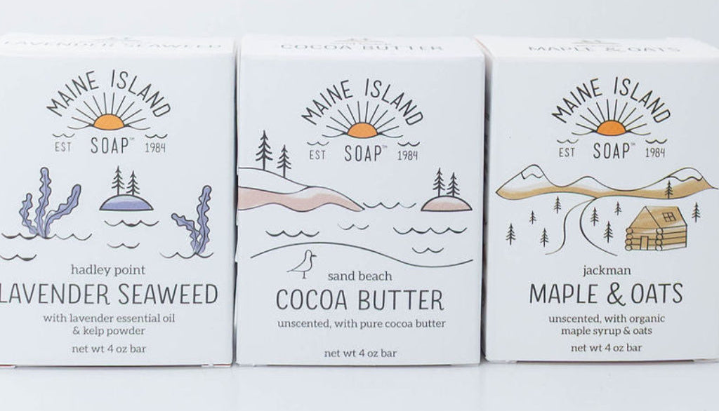 Three Maine Island Soap bars in Lavender Seaweed, Cocoa Butter, and Maple & Oats.