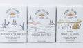 Three Maine Island Soap bars in Lavender Seaweed, Cocoa Butter, and Maple & Oats.