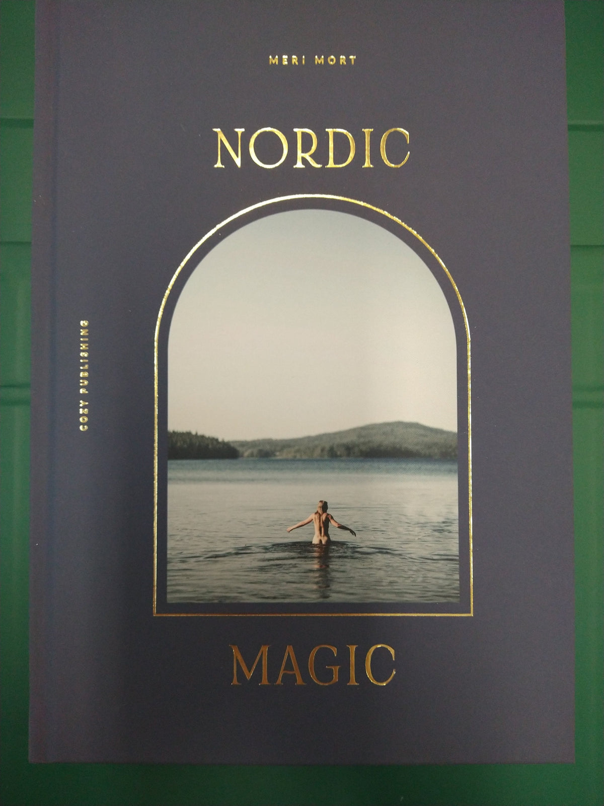 Nordic Magic by Meri Mort, hardcover book from Cozy Publishing with dark cover and gold lettering