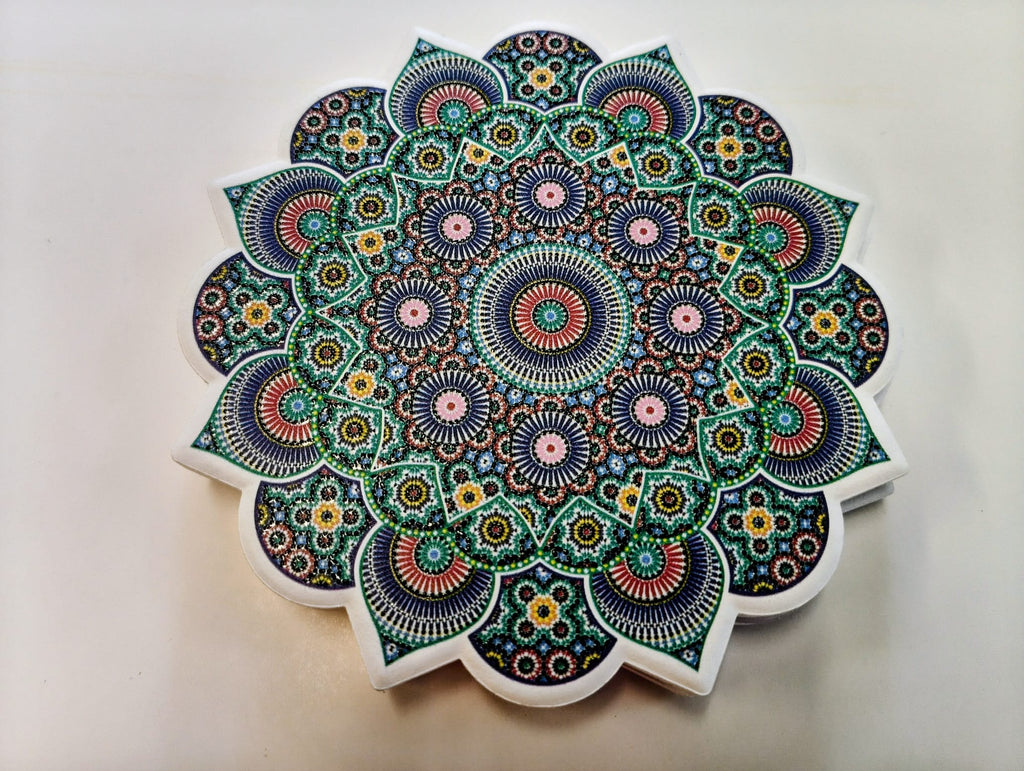 Moroccan-inspired ceramic coaster with a scalloped floral edge and intricate circular mosaic patterns in turquoise, teal, purple, pink, green and white.