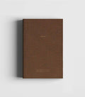 Dark brown linen hardcover notebook with gold foil lettering by Cozy Publishing.