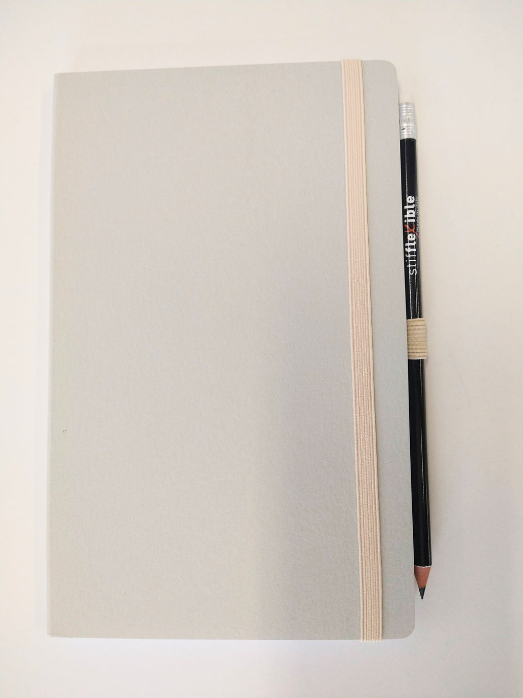Dove Gray Stifflexible notebook made in Italy with attached pencil.