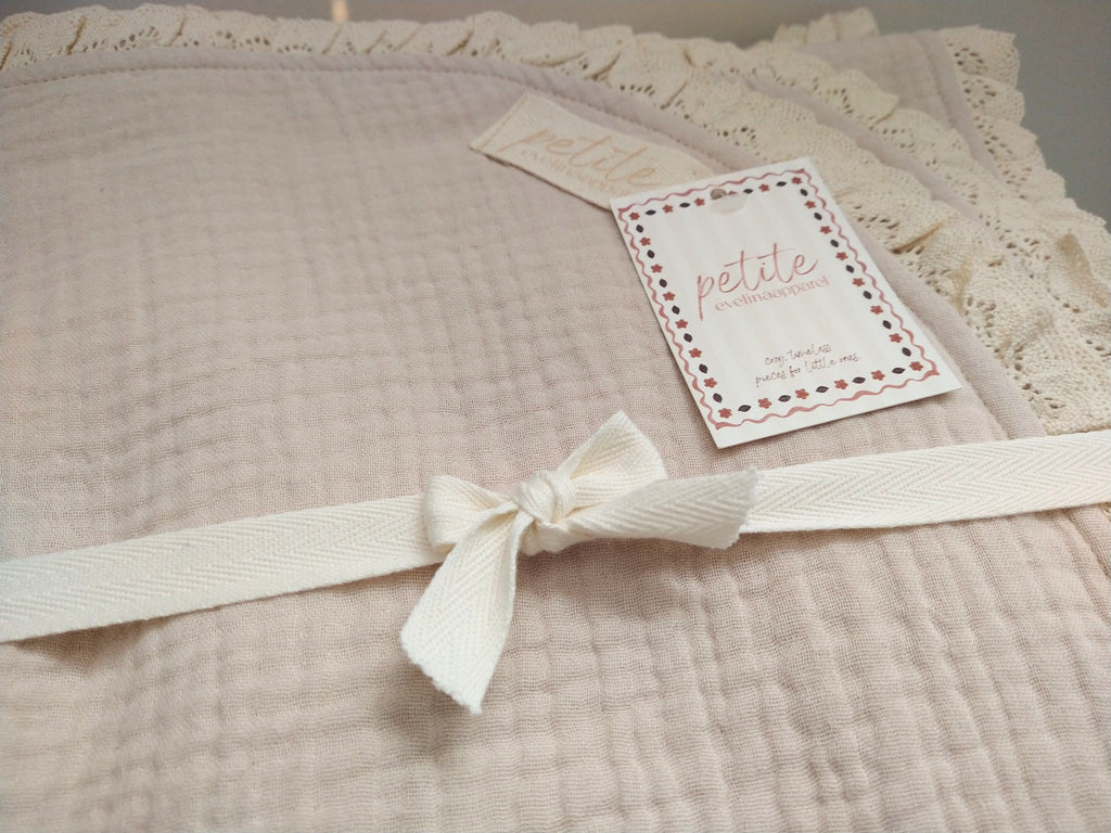 Close up photo of Petite Evelina light beige muslin baby blanket with lace 