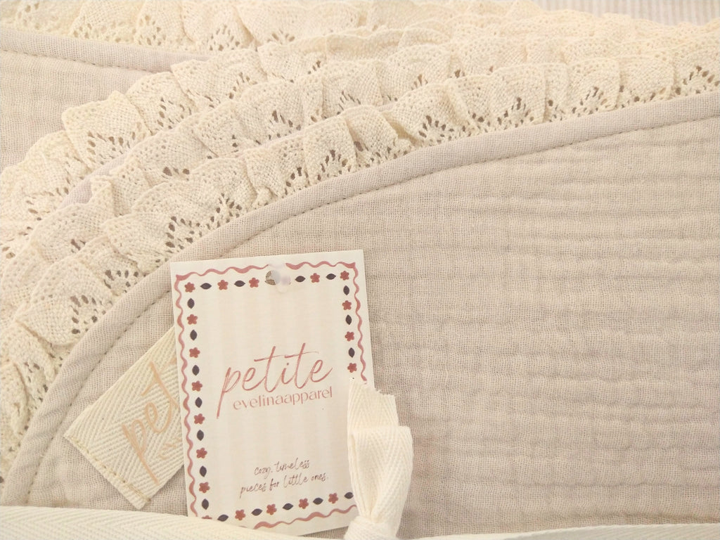 Petite Evelina light beige muslin baby blanket showing textured layers and lace trim