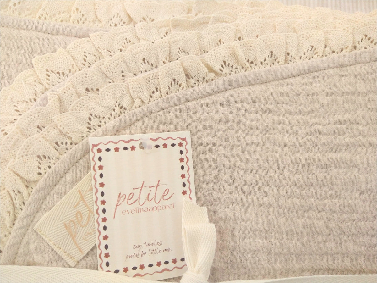 Petite Evelina light beige muslin baby blanket showing textured layers and lace trim