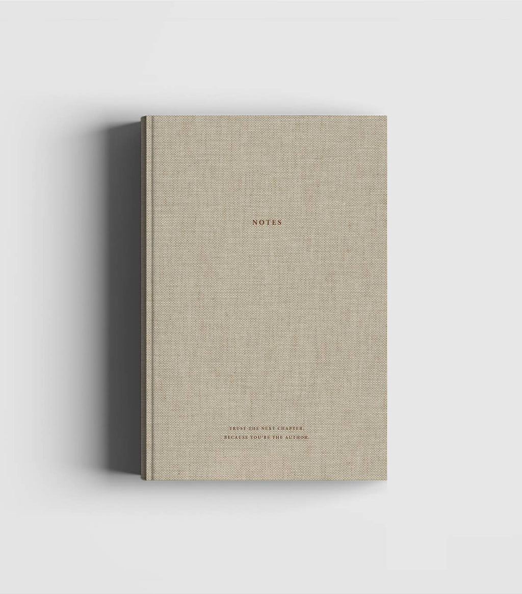Natural linen hardcover notebook with dark brown foil lettering by Cozy Publishing.