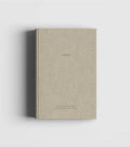 Natural linen hardcover notebook with dark brown foil lettering by Cozy Publishing.